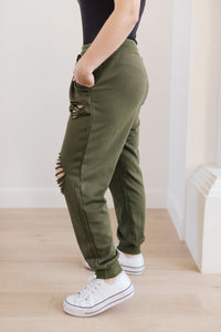 Kick Back Distressed Joggers In Olive